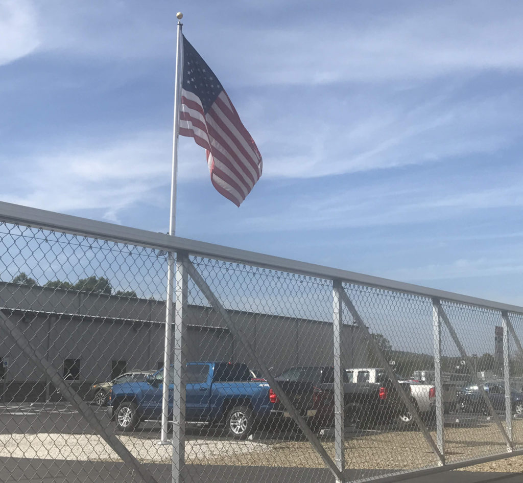 asg sharon fence facility with american flag